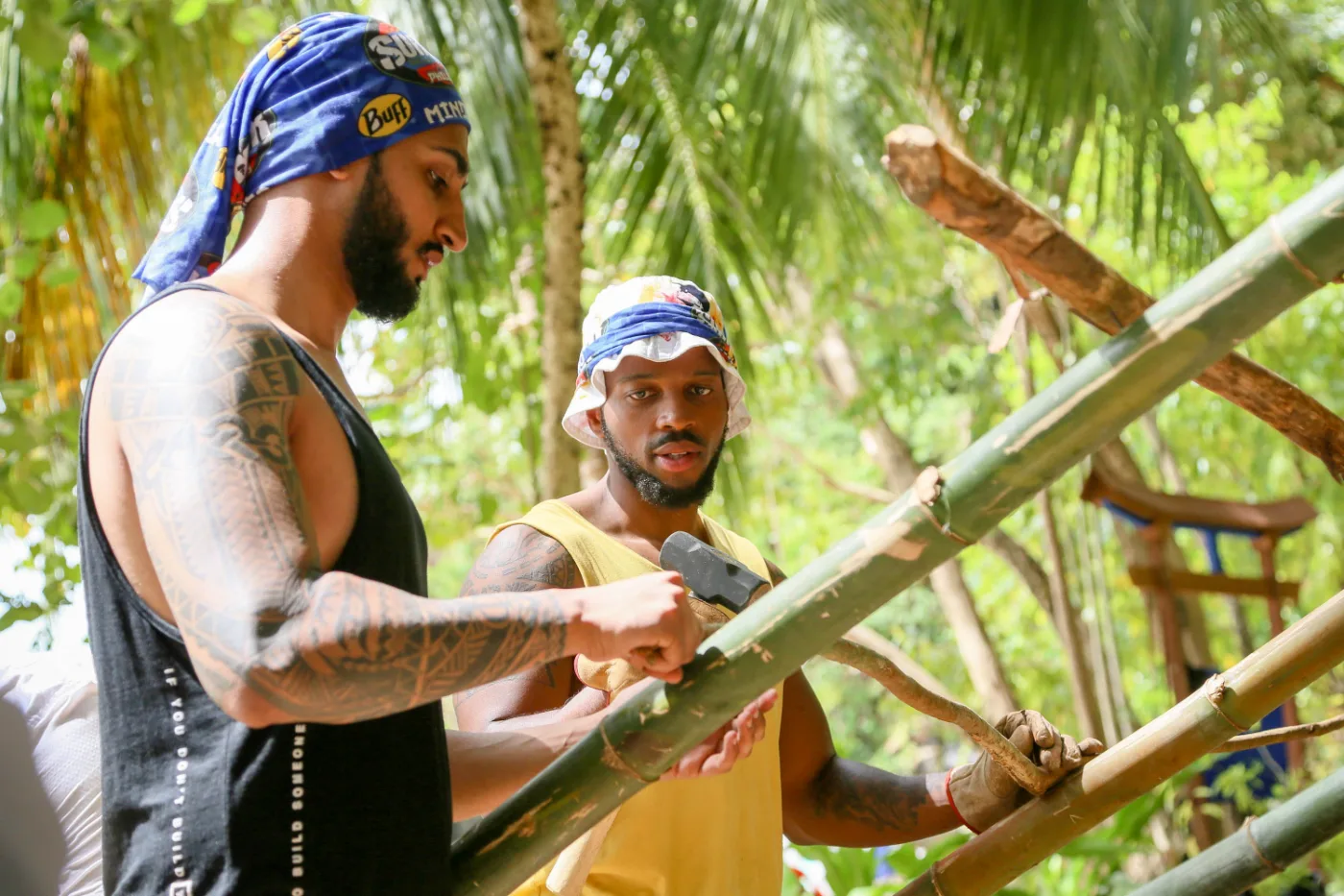 Dr Tevin Naidu building the shelter from bamboo with a fellow Mindanao castaway, Survivor South Africa: Philippines